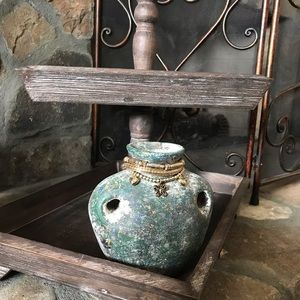 Gold bracelet set a butterfly on it.